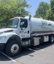 Virginia Septic truck in parking lot with trees nearby