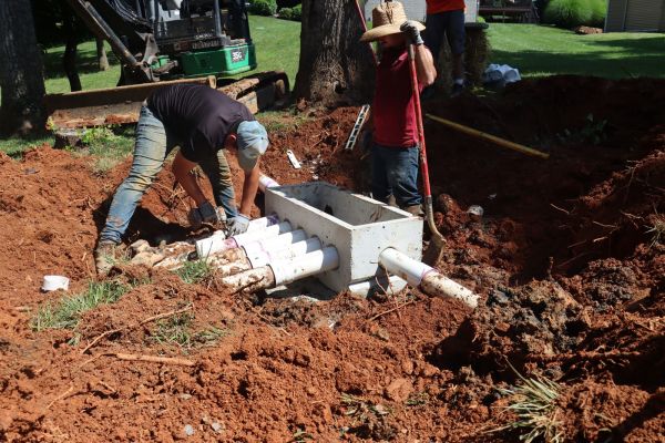 Construction maintenance of drainage system in backyard