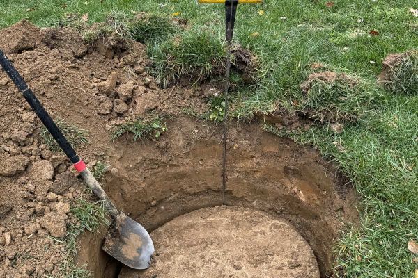 Septic tank cleaning digging out access hole for cleaning