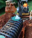 Septic tank installation in progress by workers