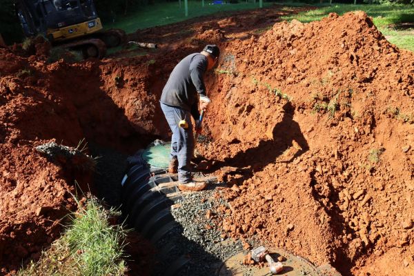 Installing septic system in dirt excavation site